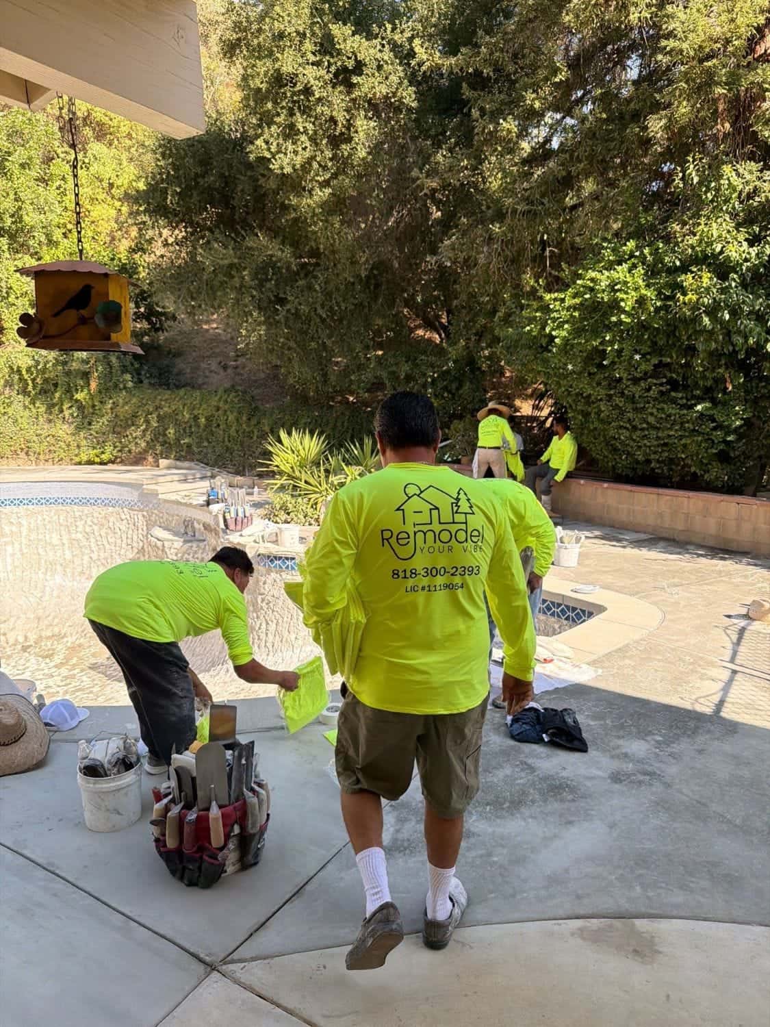 Crew setting up on the pool deck before plastering