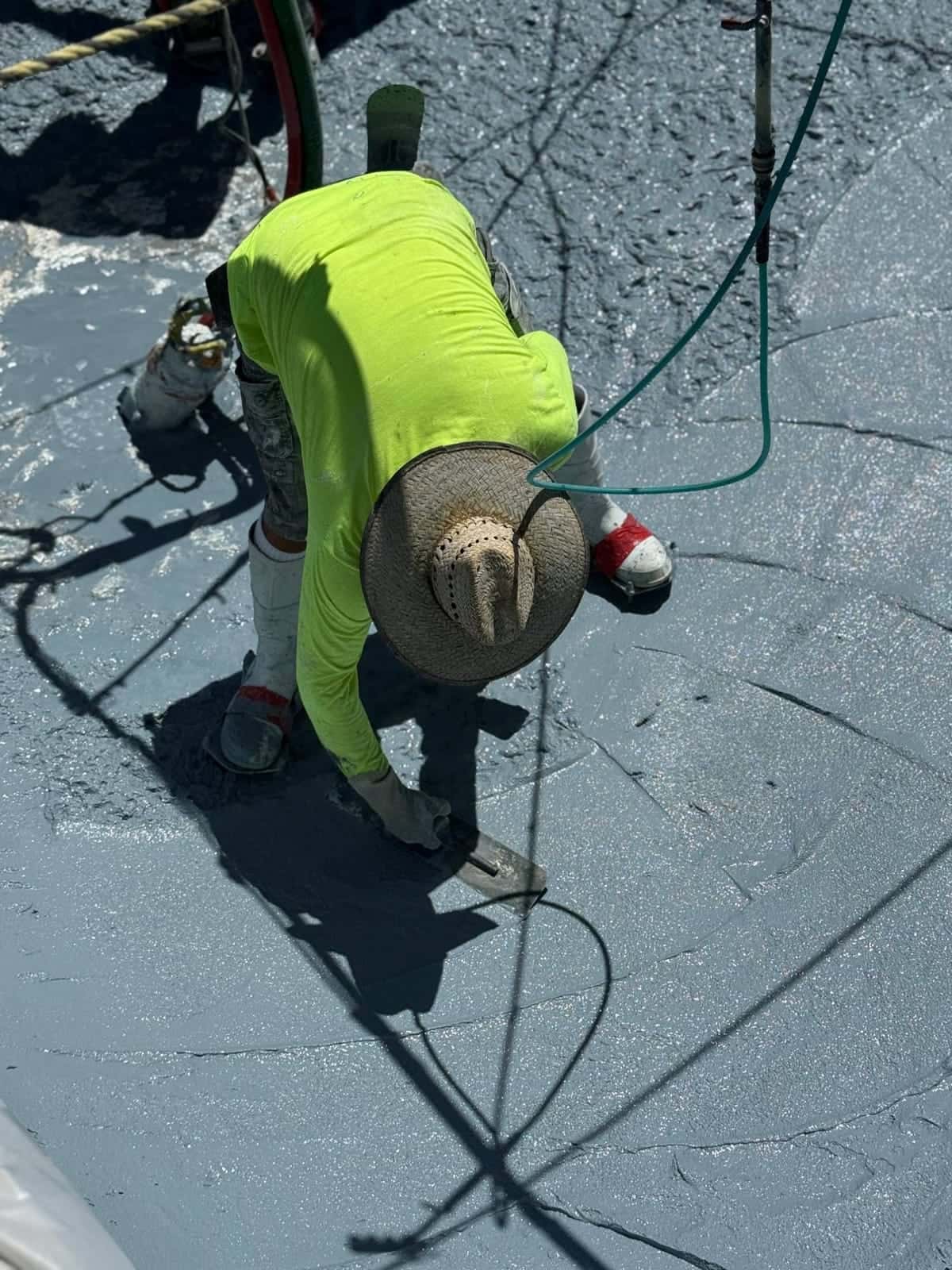 Plasterer troweling the floor of a pool