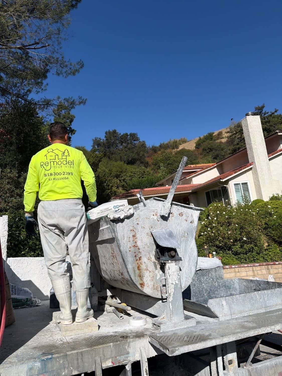 Loading the plaster mixer on the crew truck